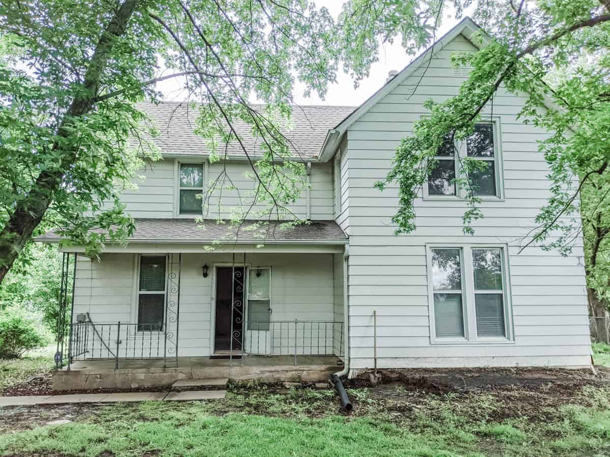 farmhouse exterior prior to remodel with white siding