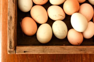 wooden crate filled with farm fresh eggs