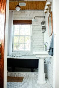 craftsman bungalow bathroom with white black and natural wood accents