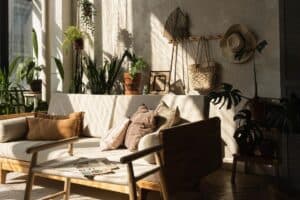 boho living room with earth toned furniture potted plants and accessories