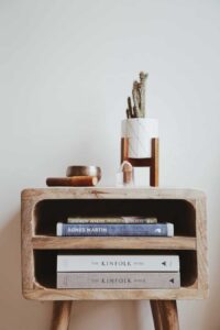 mid century nightstand with potted cactus and books 2