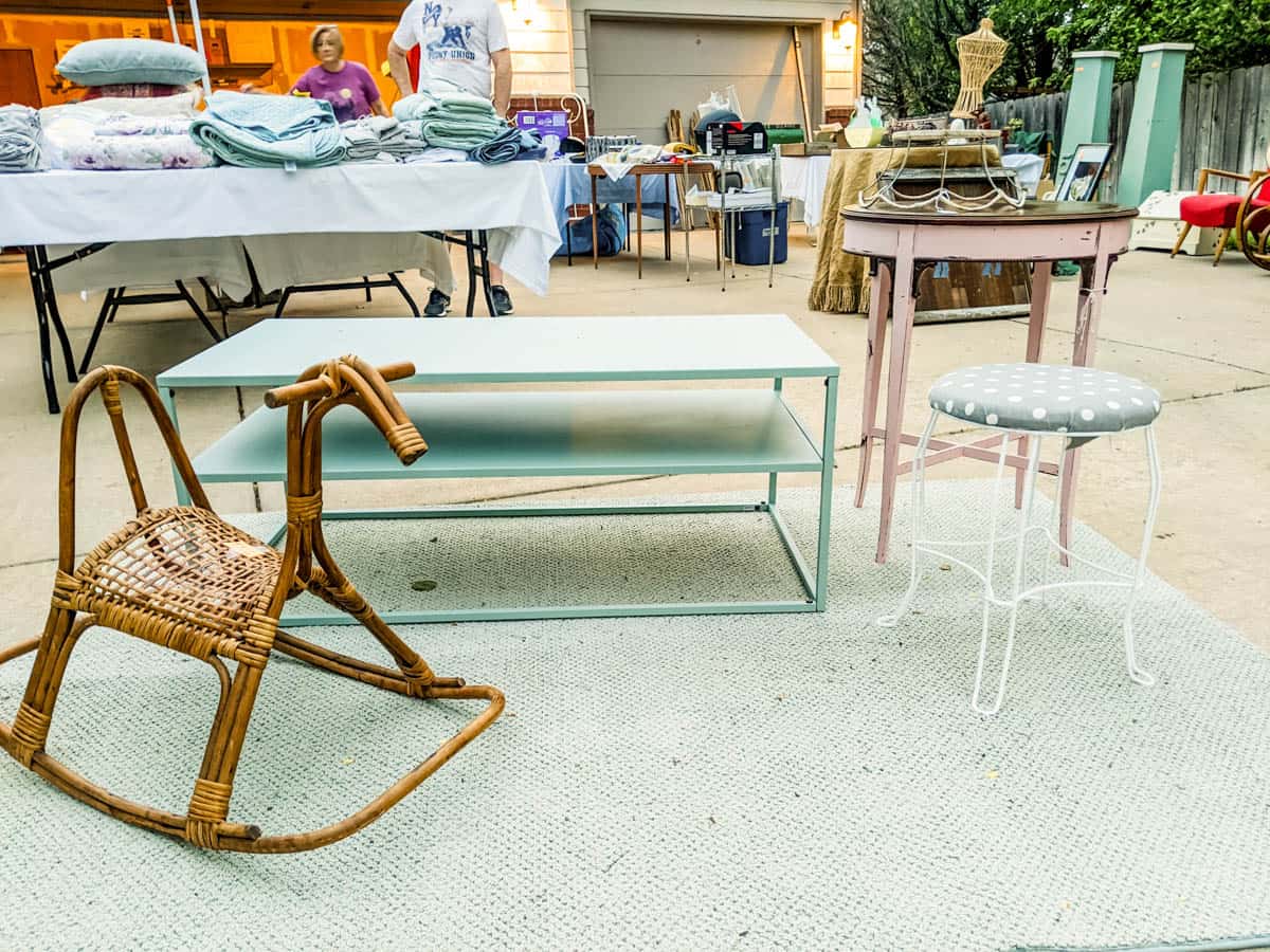 assorted items in a driveway for sale in a garage sale