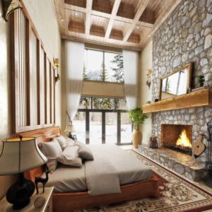 rustic cabin bedroom with low profile bed large windows and stone fireplace