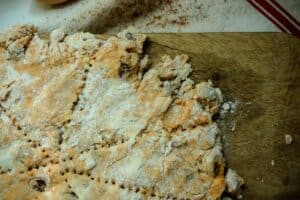 preparing fall pumpkin and maple scones batter with perforations for oven
