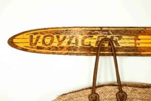 voyager wooden ski turned into a coat wrack with hanging tote bag