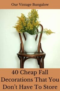 porcelain pitcher filled with goldenrod stems sitting on a vintage dining chair fall decorations