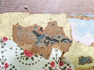 samples of three different antique floral farmhouse wallpapers found during renovation
