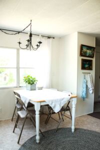 small farmhouse kitchen table in mid century style mobile home kitchen with vintage style chandelier