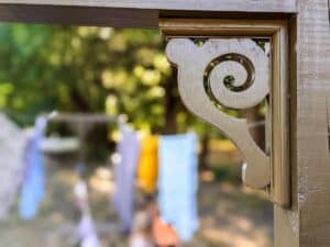 small decorative bracket added to clothesline pole for decoration