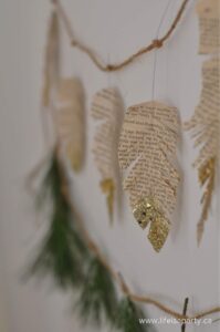 diy book page gold tipped feather garland for christmas tree