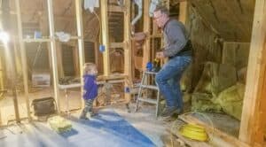 grandfather and grandson remodeling bungalow bedroom and bathroom in attic
