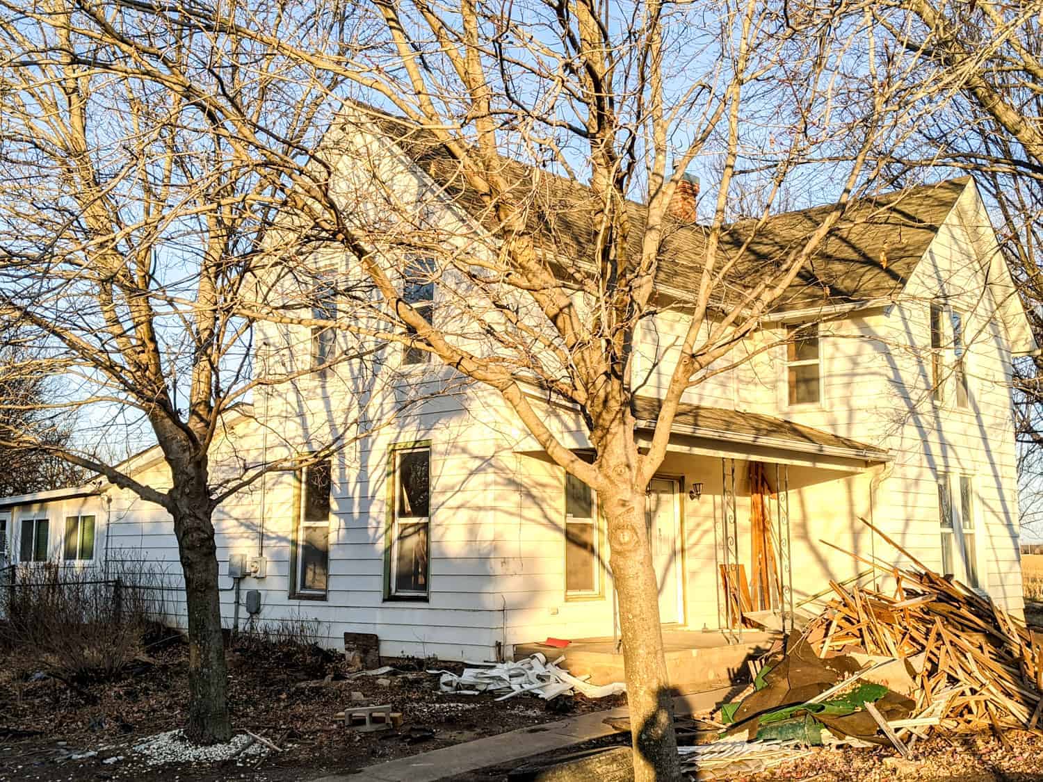 exterior of old farmhouse during renovation process